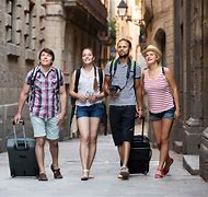 flight deals Discount Airfares - Picture of travelers walking with their luggage.
